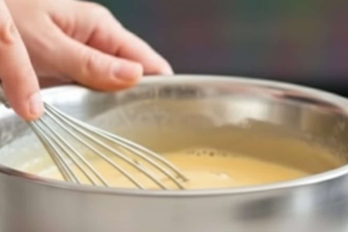 In a bowl, whisk egg, then add flour, beer, garlic powder, salt, and water.