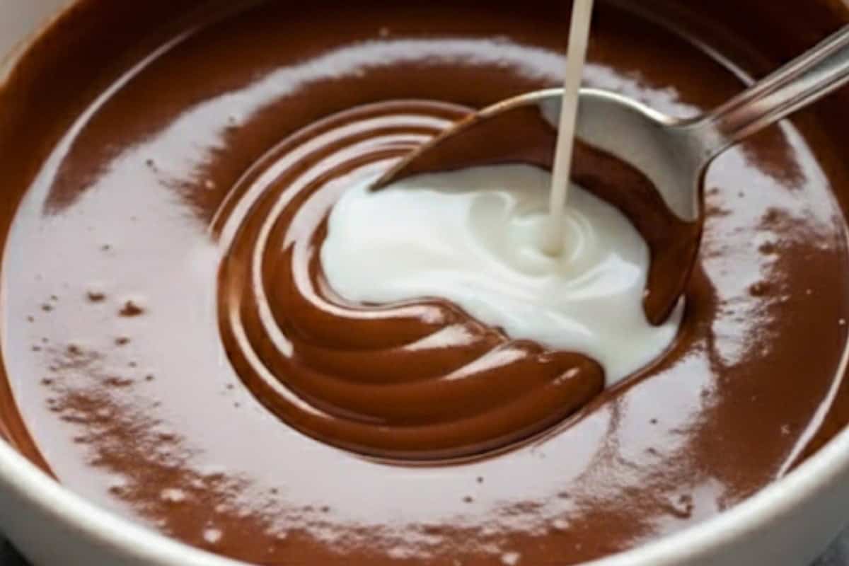 Melt 1/4 cup of Nutella in the microwave for 30–60 seconds, then beat in 3–4 tablespoons of milk until smooth