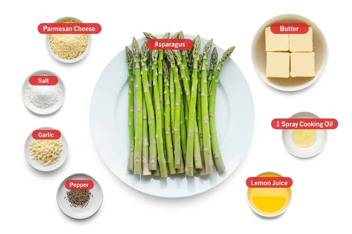 Top shot of ingredients: parmesan cheese, salt, garlic, pepper, asparagus, butter, 1 spray cooking oil, and lemon juice.