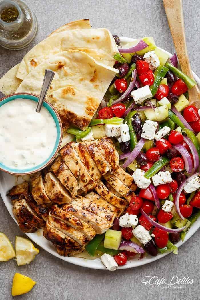 Greek Lemon Garlic Chicken Salad with an incredible dressing that doubles as a marinade! Complete with Tzatziki and homemade flatbreads, it's a winner! | http://cafedelites.com