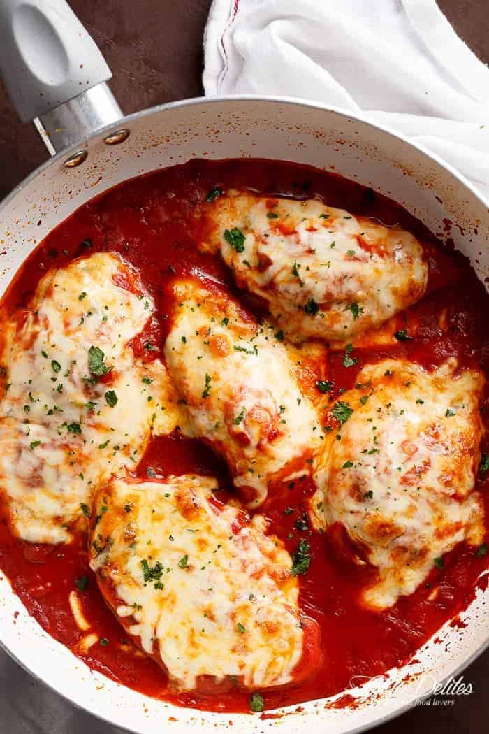 A quick and easy Mozzarella Chicken In Tomato Sauce made in the one skillet in under 15 min! A restaurant quality dinner full of flavour in half the time. | https://cafedelites.com