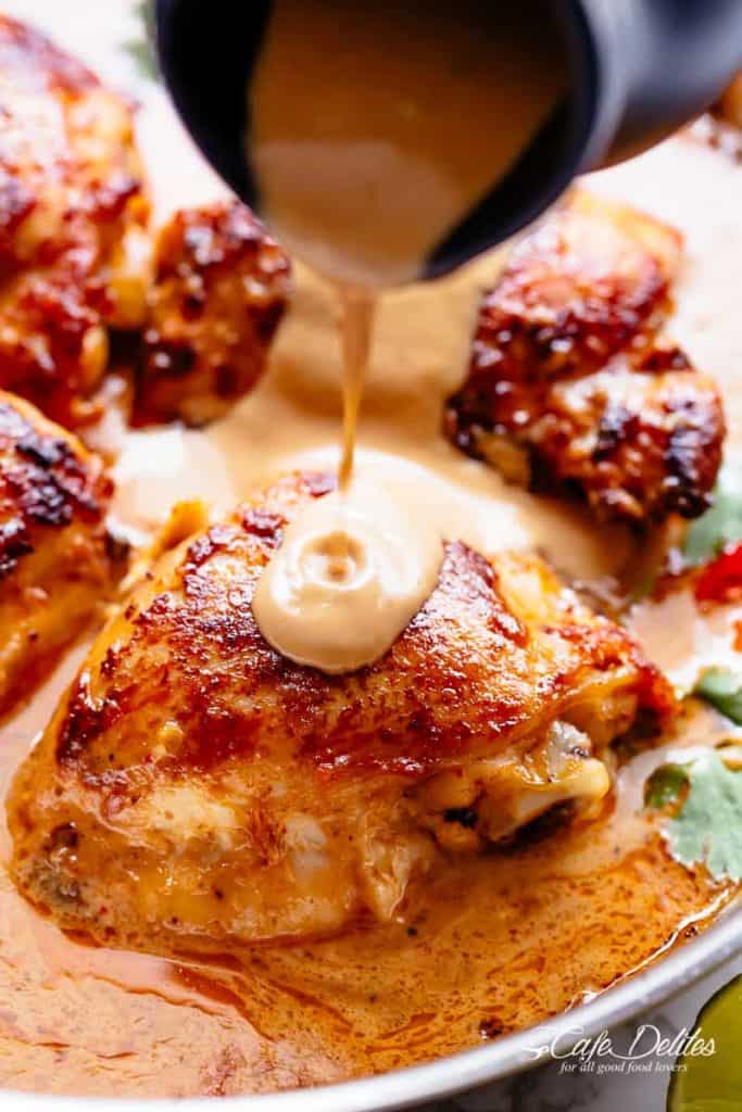 A Creamy Peanut Sauce poured on Thai Satay Chicken  