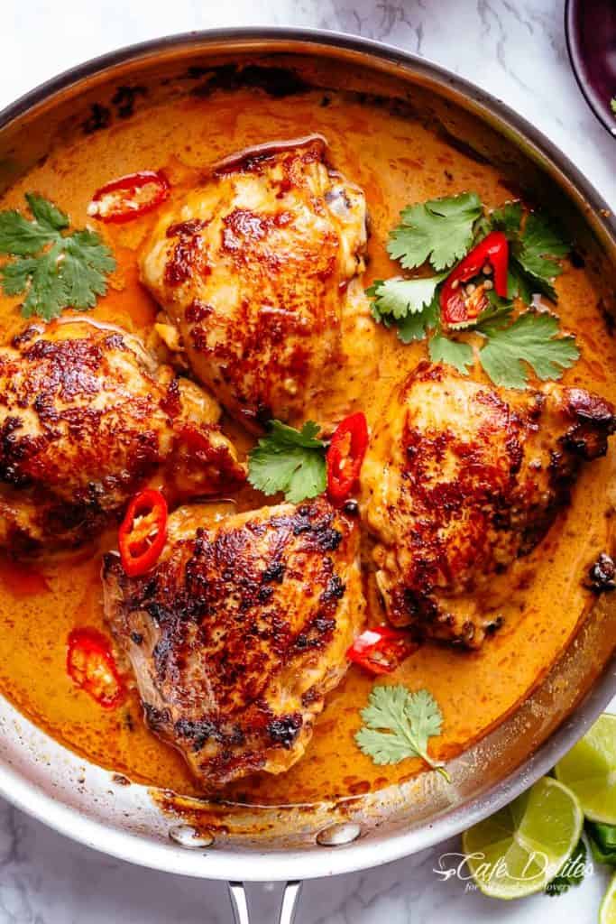 Top view image of Thai Satay Chicken In A Creamy Peanut Sauce in a pan