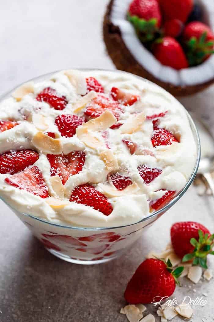 Strawberry Coconut Cheesecake Salad is similar to a parfait with no layering necessary! Just ripe and juicy strawberries and with a creamy cheesecake cream! | https://cafedelites.com