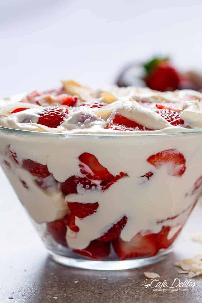 Strawberry Coconut Cheesecake Salad is similar to a parfait with no layering necessary! Just ripe and juicy strawberries and with a creamy cheesecake cream! | https://cafedelites.com