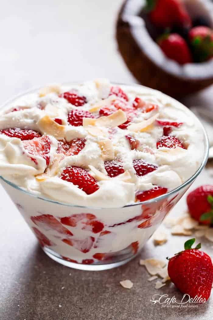 Strawberry Coconut Cheesecake Salad is similar to a parfait with no layering necessary! Just ripe and juicy strawberries and with a creamy cheesecake cream! | https://cafedelites.com