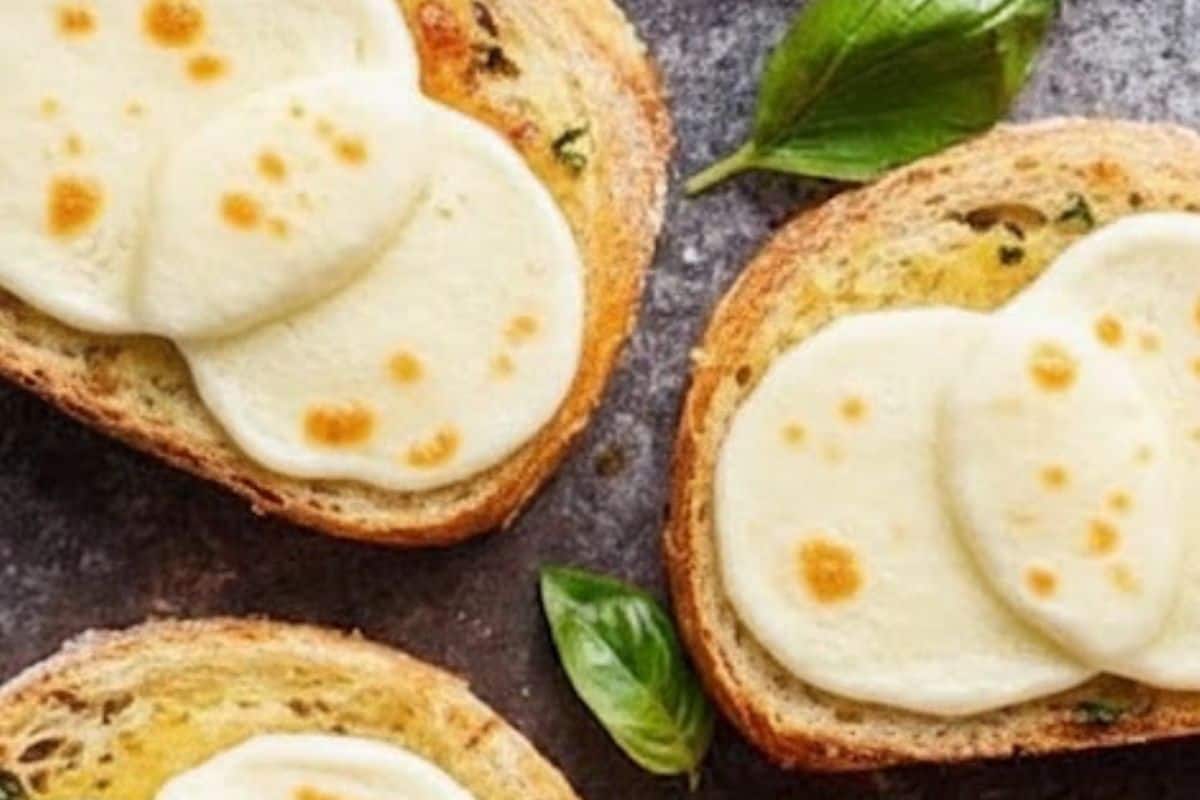 Top each buttered slice with fresh mozzarella, either sliced or shredded, and broil - 6