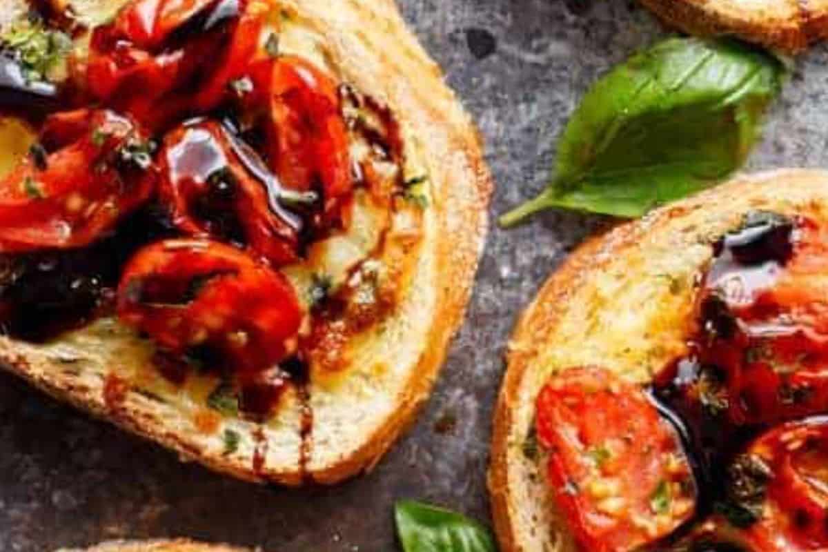 In a saucepan, bring balsamic vinegar and sugar to a boil over medium heat. Allow to cool and drizzle over the prepared garlic bread. - 8