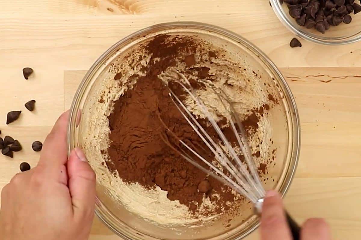 Whisked the melted butter with both sugars, then added in the cocoa powder in a medium bowl. - 4