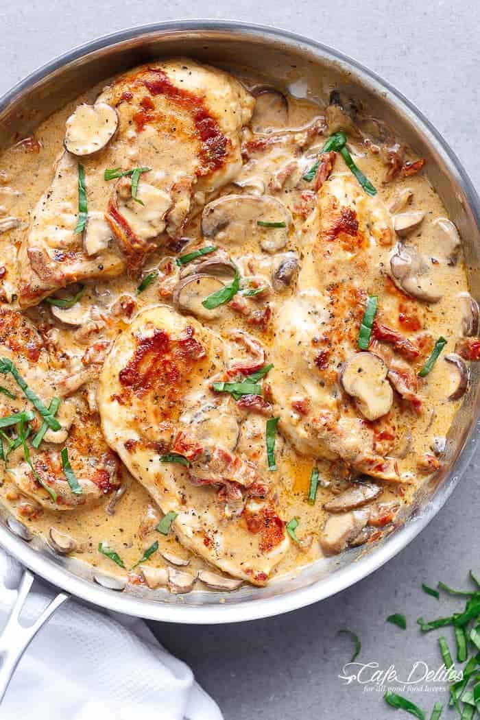 A Creamy Sun Dried Tomato Parmesan Chicken with Mushrooms that is Gluten Free and made with NO HEAVY CREAM.....or ANY cream.....at ALL! | https://cafedelites.com