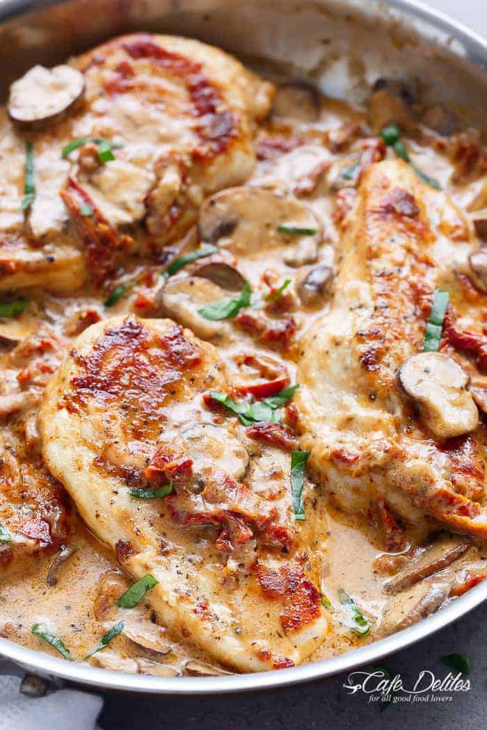 A thick and creamy Sun Dried Tomato Parmesan Chicken with Mushrooms Creamy Sun Dried Tomato Parmesan Chicken (No Cream)