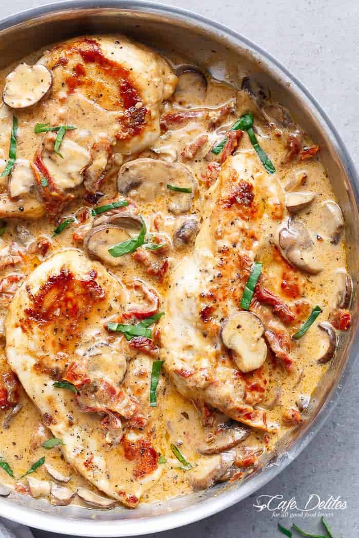 A Creamy Sun Dried Tomato Parmesan Chicken with Mushrooms that is Gluten Free and made with NO HEAVY CREAM.....or ANY cream.....at ALL! | https://cafedelites.com