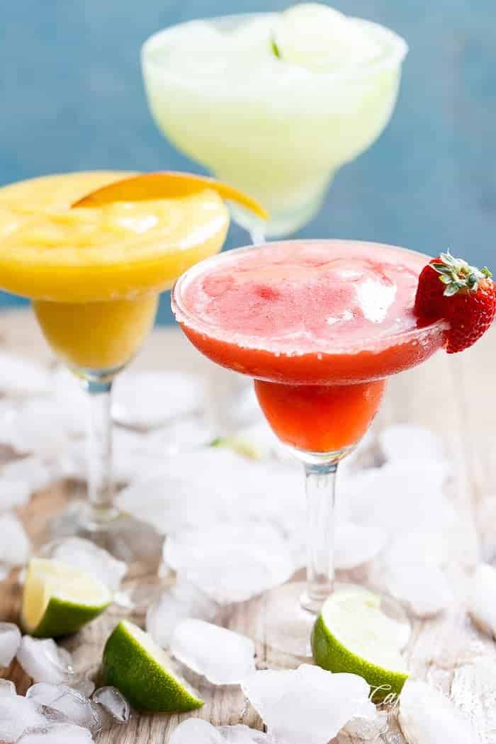 Frozen Strawberry and Mango Margaritas are refreshing and fruity and even better than the original Margarita! Celebrate in style! | https://cafedelites.com