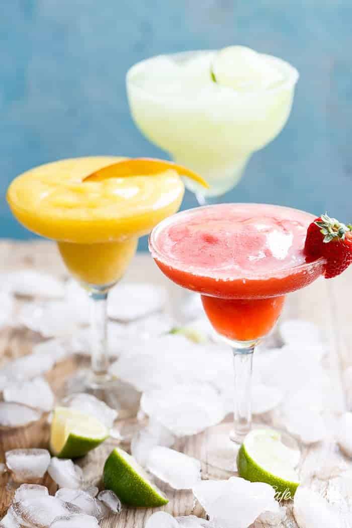 Frozen Strawberry and Mango Margaritas are refreshing and fruity and even better than the original Margarita! Celebrate in style! | https://cafedelites.com