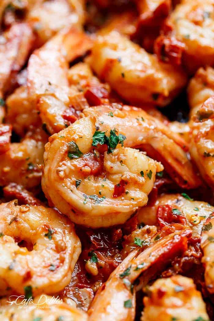 Spicy and garlicky with the subtle sweetness of sun dried tomatoes, this Spicy Garlic Sun Dried Tomato Shrimp takes less than 10 minutes! | https://cafedelites.com