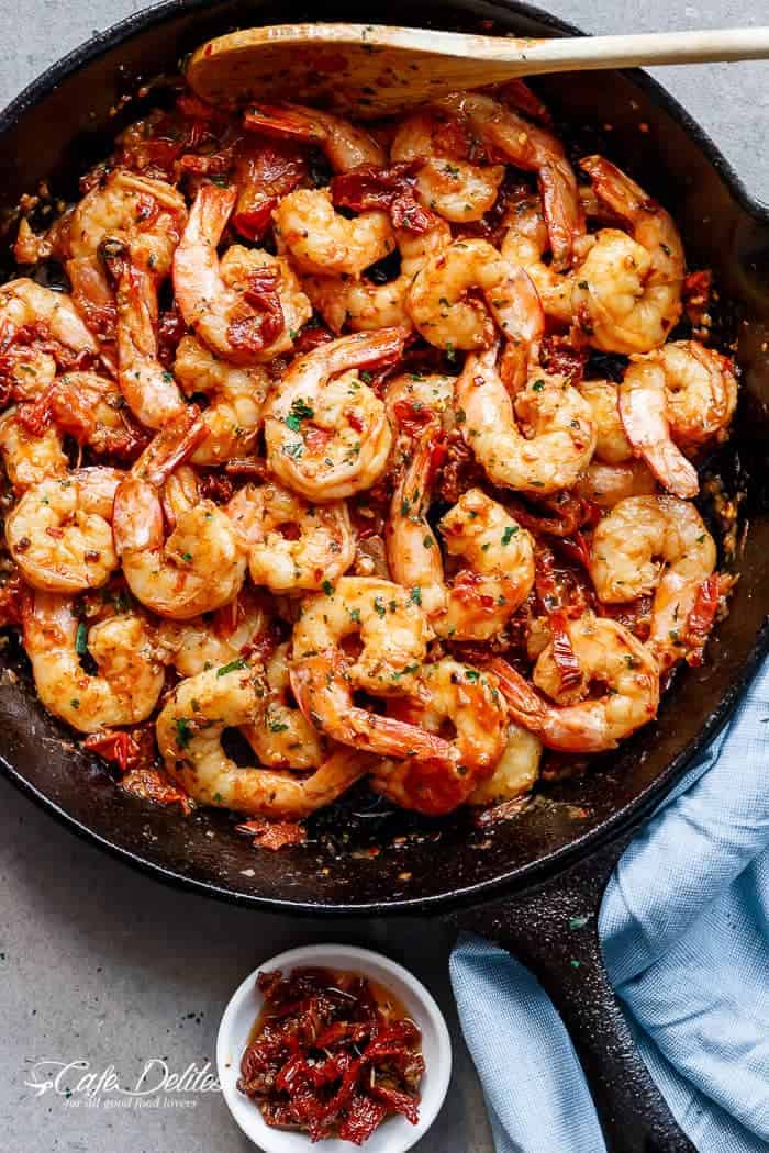 Spicy and garlicky with the subtle sweetness of sun dried tomatoes, this Spicy Garlic Sun Dried Tomato Shrimp takes less than 10 minutes! | https://cafedelites.com