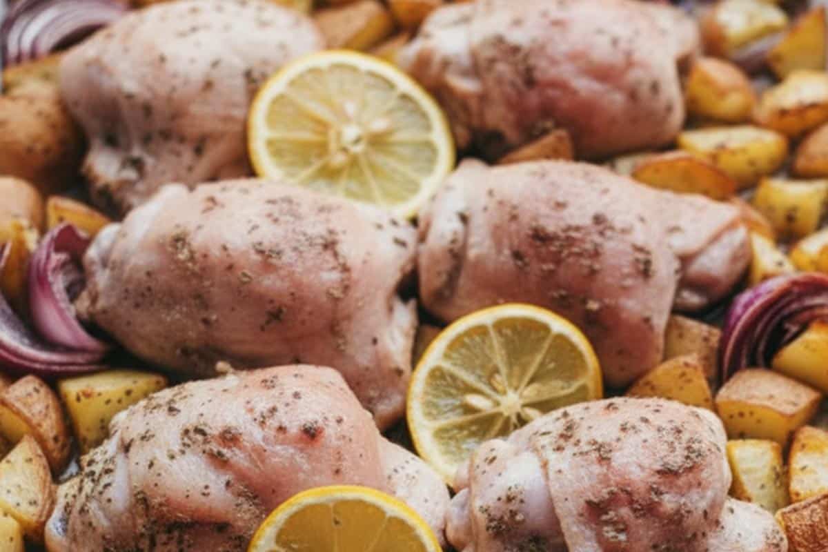 Placed the slices of lemon over the chicken and potatoes.