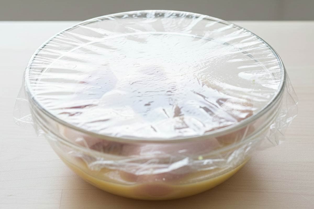 Marinate the chicken in the bowl and cover. - 4