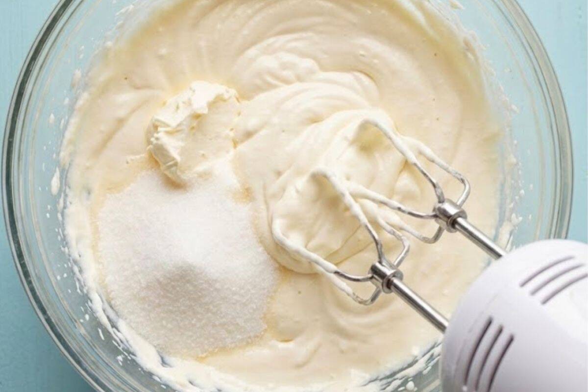 In a large bowl, beat the cream cheese, cream, and sugar with an electric mixer. - 4