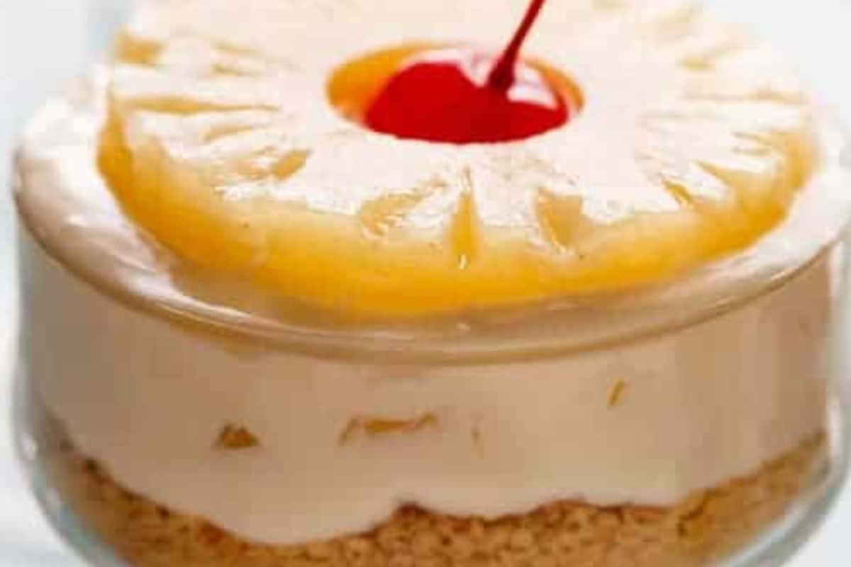 Top each cheesecake with extra pineapple and finish with a maraschino cherry placed in the centre  - 8