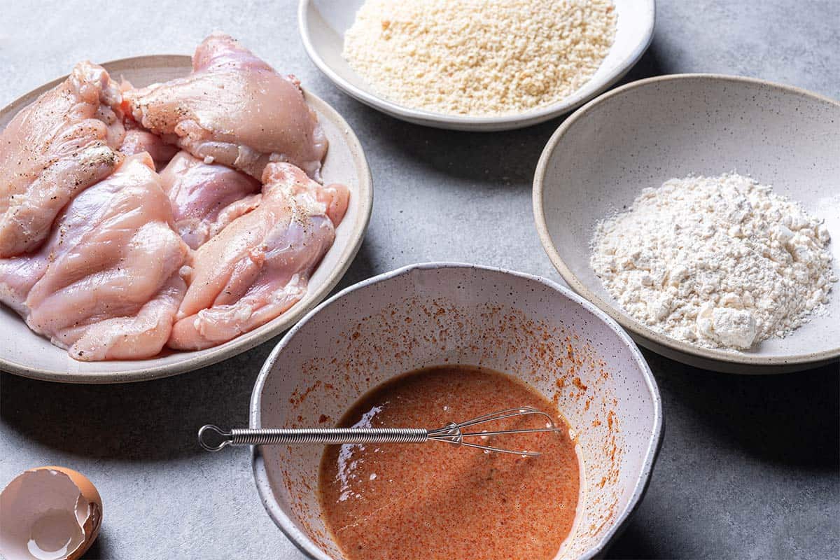 seasoned chicken with dredging station set up