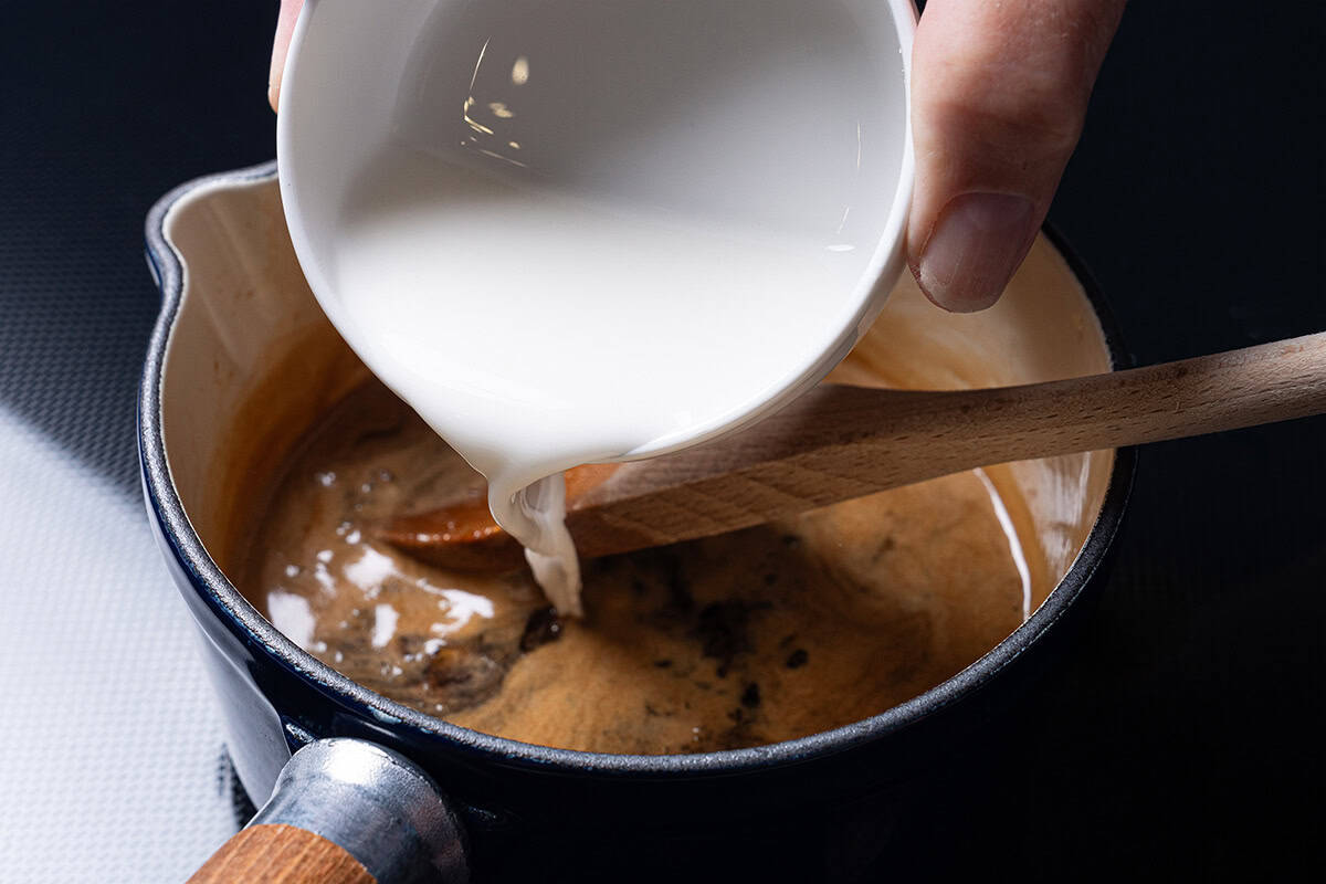 honey garlic sauce being made inside a pot