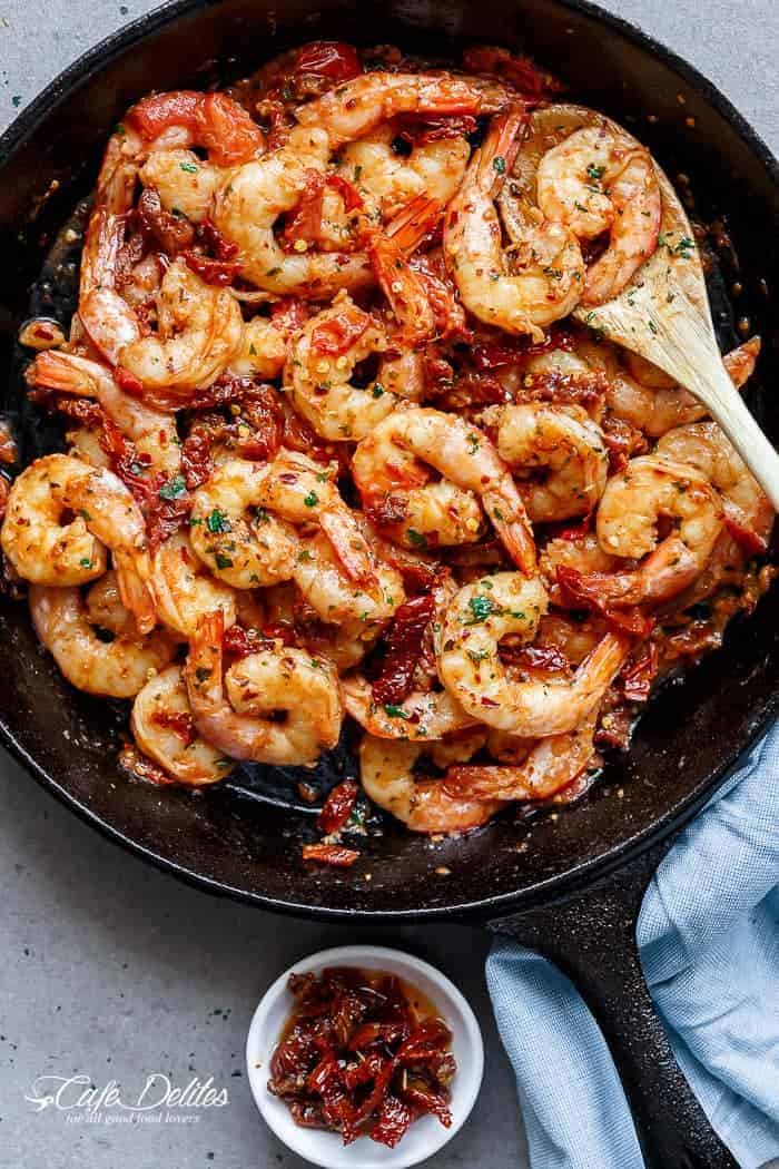 Spicy and garlicky with the subtle sweetness of sun dried tomatoes, this Spicy Garlic Sun Dried Tomato Shrimp takes less than 10 minutes! | https://cafedelites.com