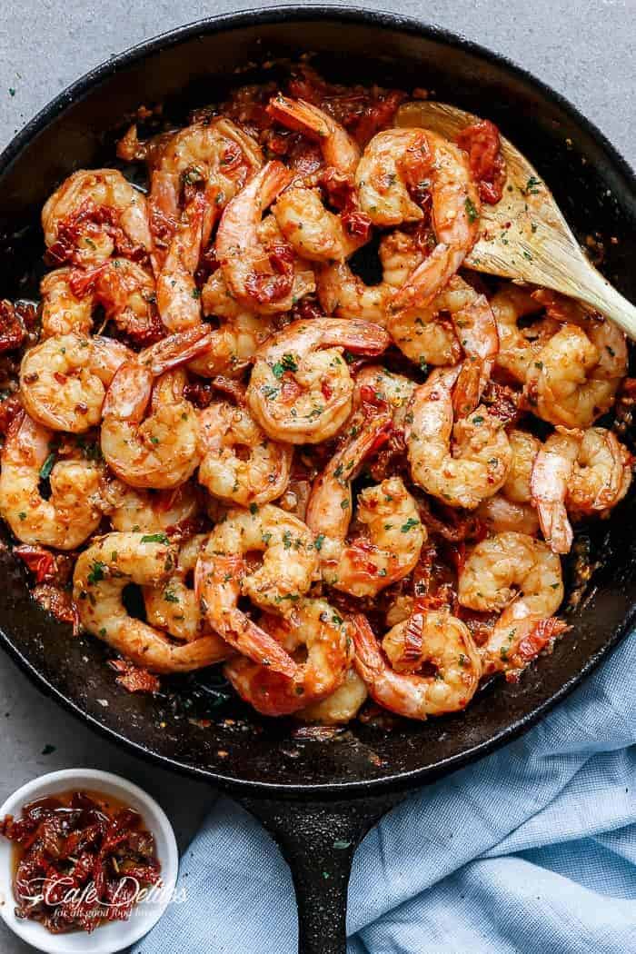 Spicy and garlicky with the subtle sweetness of sun dried tomatoes, this Spicy Garlic Sun Dried Tomato Shrimp takes less than 10 minutes! | https://cafedelites.com