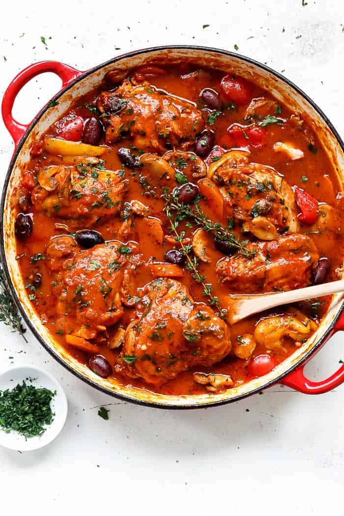 Slow cooked Chicken Cacciatore, with chicken falling off the bone in a rich and rustic sauce is simple Italian comfort food at its best. | https://cafedelites.com