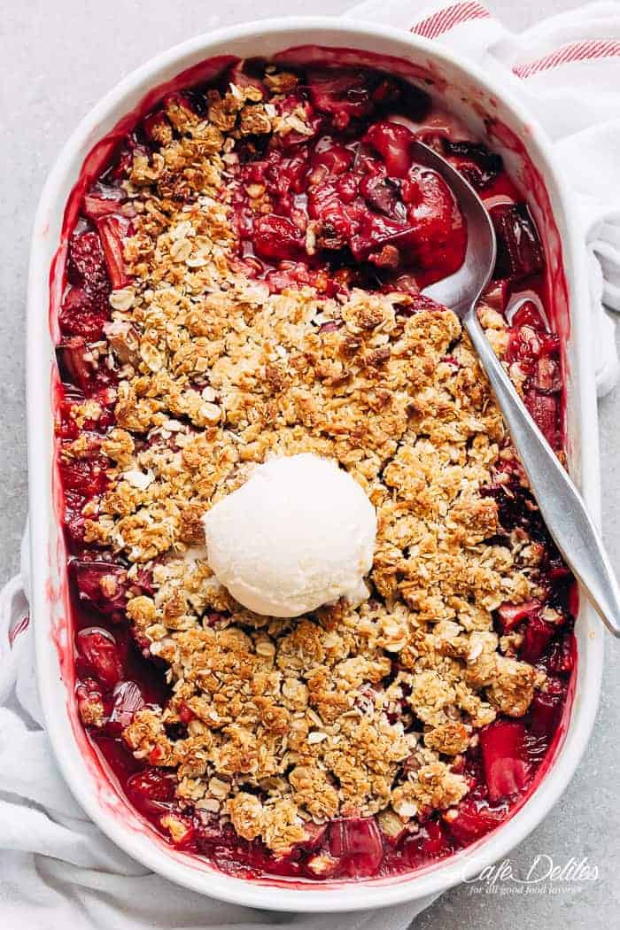 Strawberry Rhubarb Crisp is quick and easy to make desserts at only 263 calories per serve! Strawberries mix with rhubarb underneath an oatmeal cookie-like crisp! | https://cafedelites.com