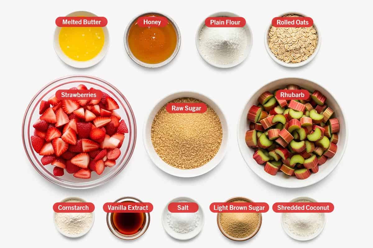 Top shot of ingredients: Melted butter, honey, plain flour, rolled oats, strawberries, raw sugar, rhubarb, cornstarch, vanilla extract, salt, light brown sugar, shredded coconut.