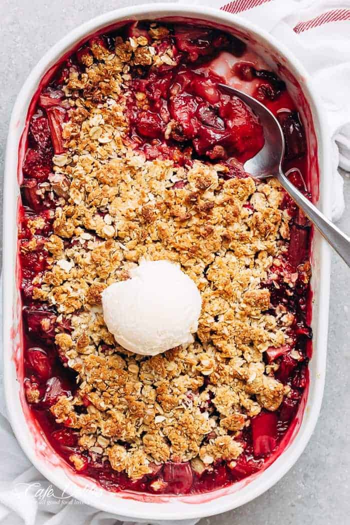 Strawberry Rhubarb Crisp is quick and easy to make desserts at only 263 calories per serve! Strawberries mix with rhubarb underneath an oatmeal cookie-like crisp! | https://cafedelites.com