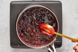 showing the sauce in a metal spoon