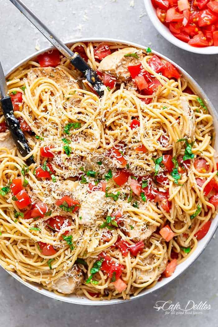 Bruschetta Chicken Pasta Salad is a must make for any occasion in minutes! Filled with Italian seasoned grilled chicken, garlic and parmesan cheese! | https://cafedelites.com