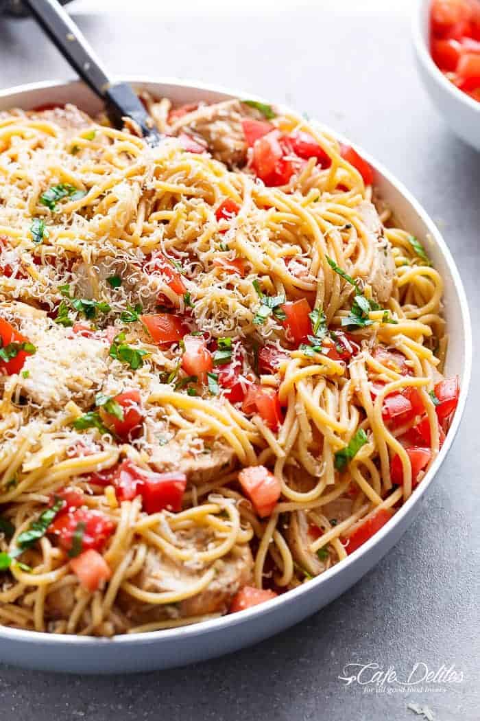 Bruschetta Chicken Pasta Salad is a must make for any occasion in minutes! Filled with Italian seasoned grilled chicken, garlic and parmesan cheese! | https://cafedelites.com