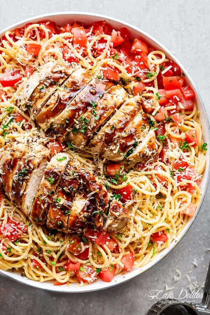 Bruschetta Chicken Pasta Salad is a must make for any occasion in minutes! Filled with Italian seasoned grilled chicken, garlic and parmesan cheese! | https://cafedelites.com