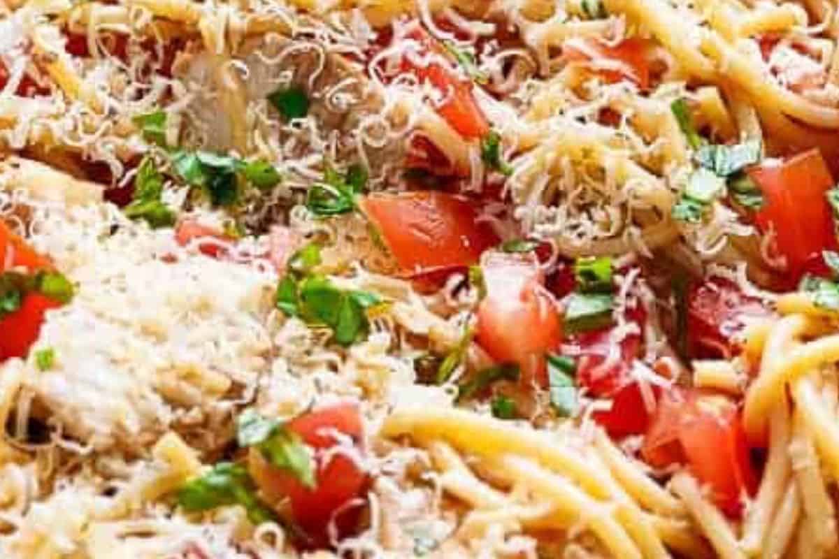 Add balsamic vinegar, parmesan, and chopped basil. Slice the chicken and toss it into the pasta until evenly coated.