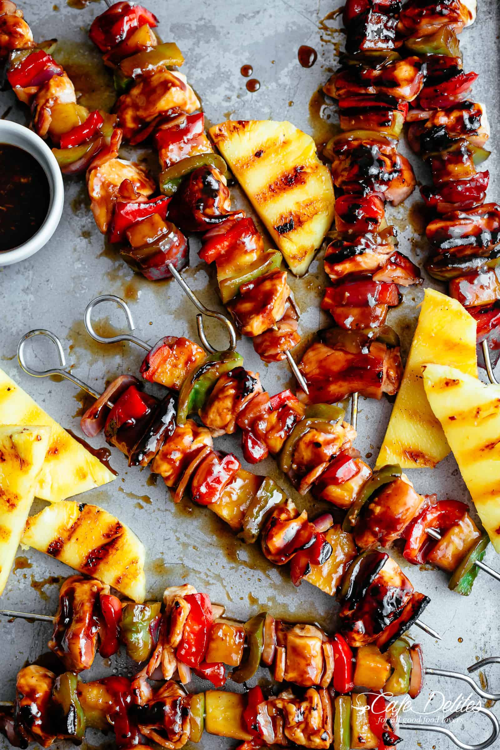 Hawaiian Bacon Pineapple Chicken Kebabs smothered in a garlicky-BBQ sauce! | https://cafedelites.com