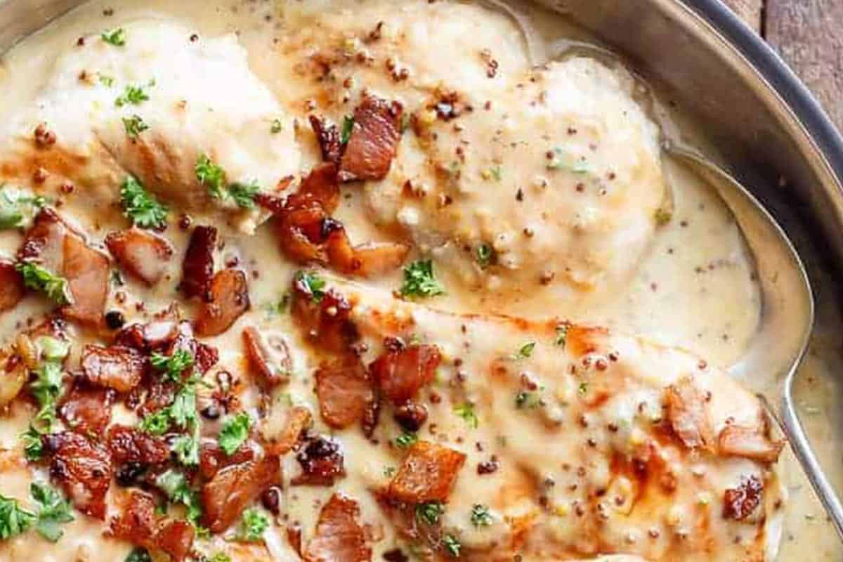 Close-up shot of Creamy Honey Mustard Chicken With Crispy Bacon.