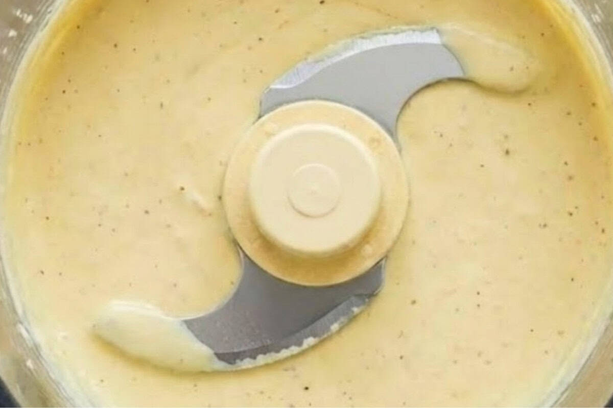 Add yogurt, mayo, olive oil, garlic, anchovy, lemon juice, and Parmesan to a food processor - 7