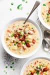A Slow Cooker Chicken Potato Corn Chowder with crispy bacon pieces and mozzarella cheese! As simple as throwing ingredients into a slow cooker and letting it cook for you! (No Cream and Dairy Free Options!) | http://cafedelites.com