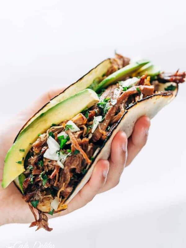 Slow Cooker Barbacoa Short Rib Tacos in hand