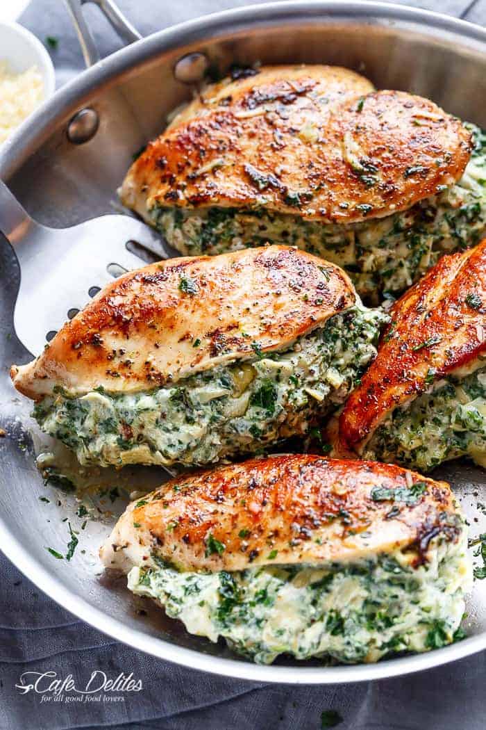 Spinach Artichoke Stuffed Chicken is a delicious way to turn a creamy dip into an incredible dinner! Serve it with a creamy sauce for added flavour! | https://cafedelites.com