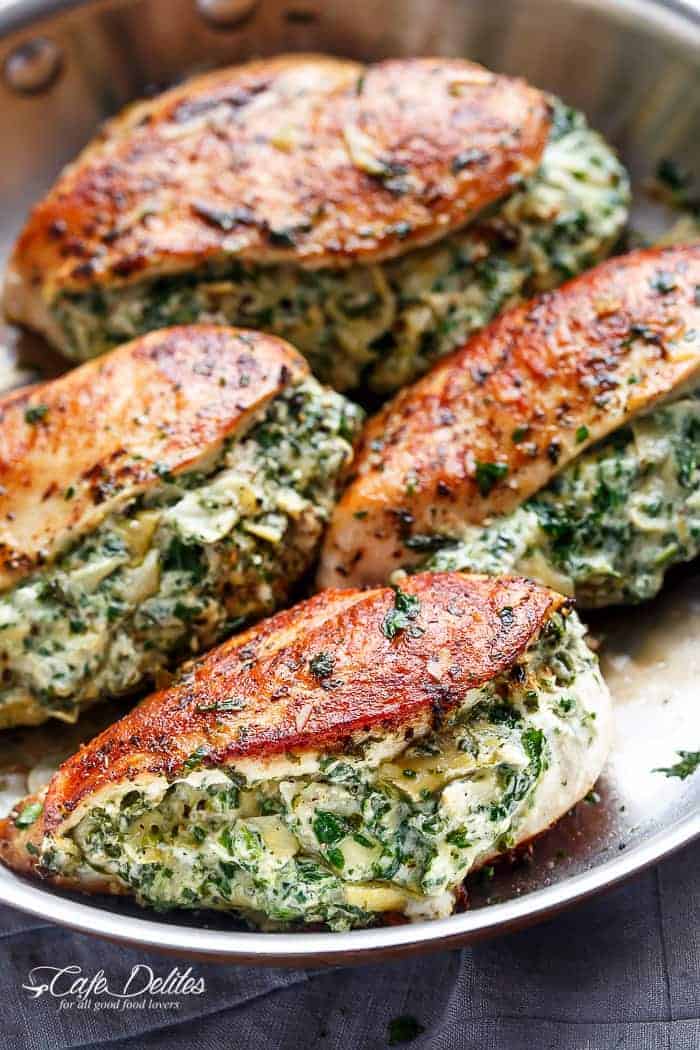 Spinach Artichoke Stuffed Chicken is a delicious way to turn a creamy dip into an incredible dinner! Serve it with a creamy sauce for added flavour! | https://cafedelites.com