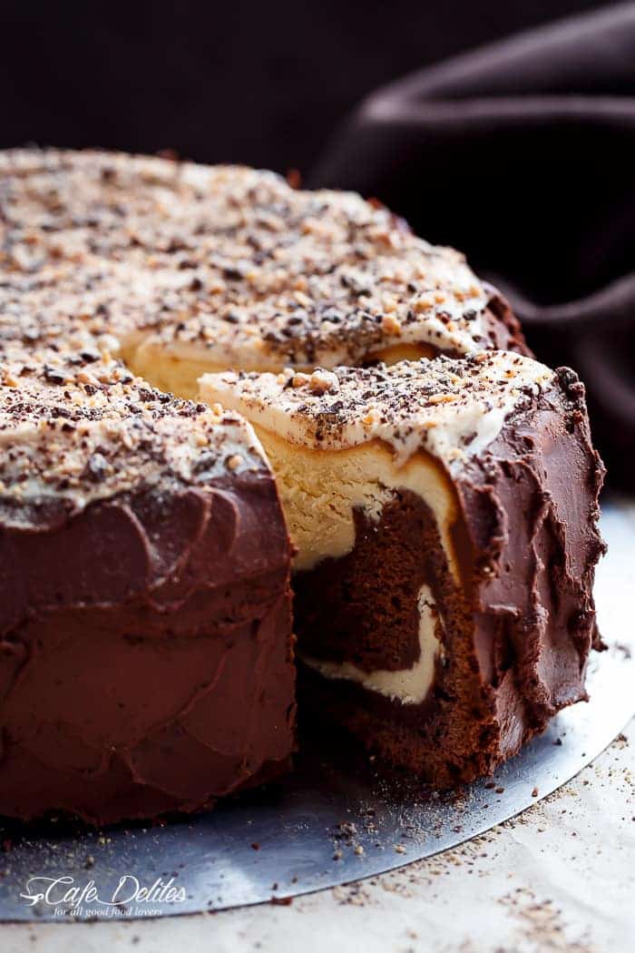 Chocolate Peanut Butter Cheesecake Cake made in the ONE pan! Creamy peanut butter cheesecake bakes on top of a fudgy chocolate cake for the ultimate dessert! | https://cafedelites.com