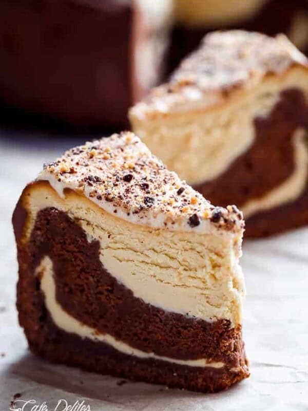 Creamy peanut butter cheesecake bakes on top of a fudgy chocolate cake slice
