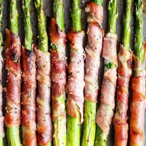 Garlic Butter Prosciutto Wrapped Asparagus on a pan