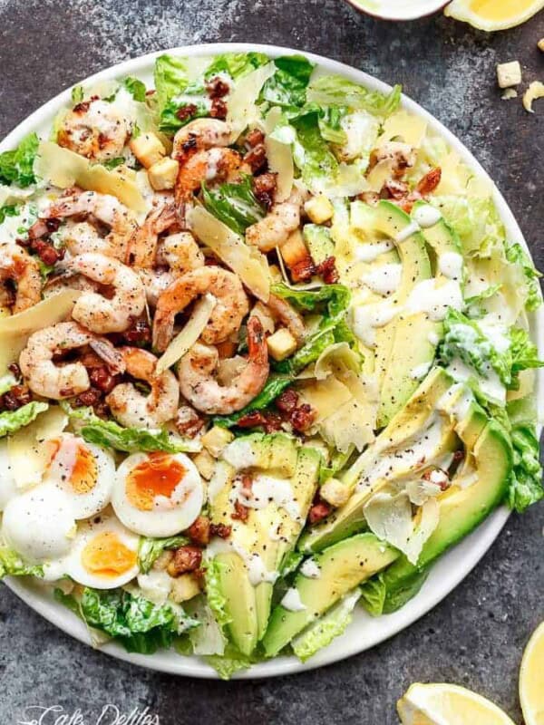 Grilled Lemon Garlic Shrimp Caesar Salad on a platter