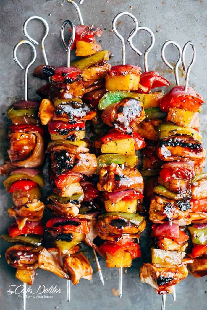Hawaiian Chicken Bacon Pineapple Kebabs with a BBQ twist! Crispy bacon and chicken smothered in a Hawaiian style pineapple and barbecue sauce, these skewers are so addictive! | https://cafedelites.com