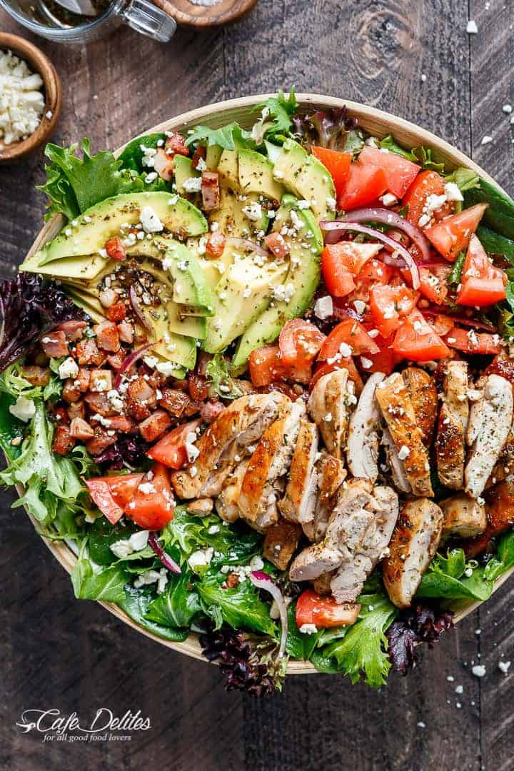 BLT Balsamic Chicken Avocado Feta Salad is a delicious twist to a BLT in a bowl, with a balsamic dressing that doubles as a marinade! You won't even miss the bread in this mega loaded salad. | http://cafedelites.com